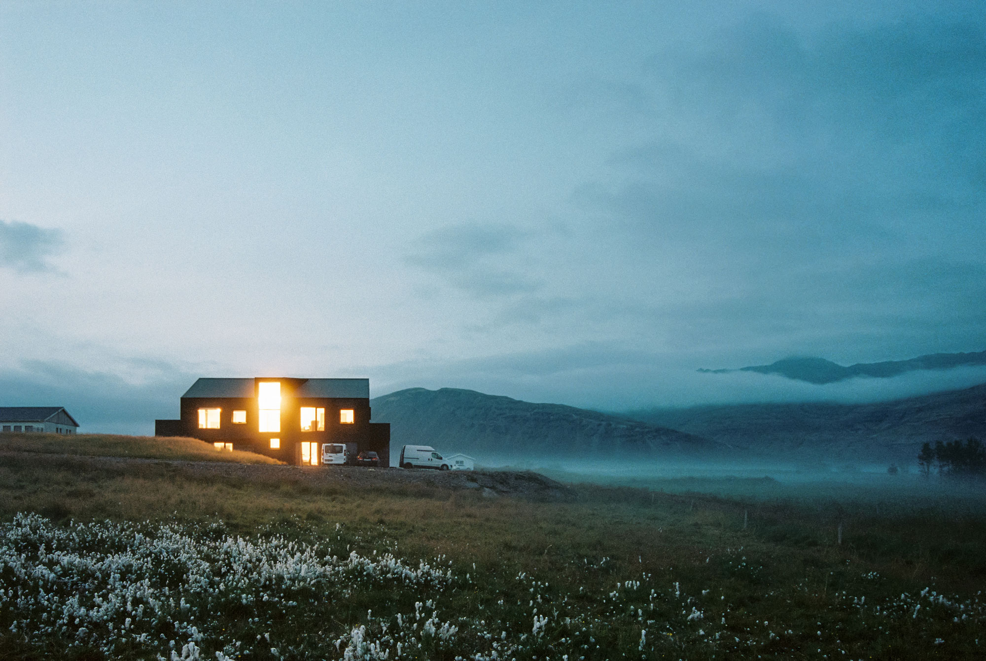Twilight home in Iceland mountains in the background