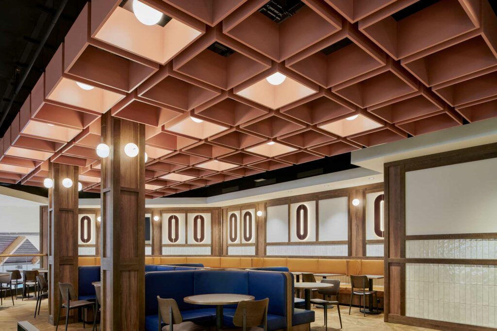 Food court with boxed ceiling and blue and mustard leather seats