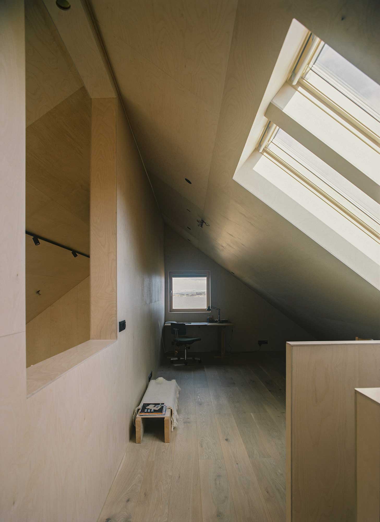 Summer home with wooden interior and large sunny windows