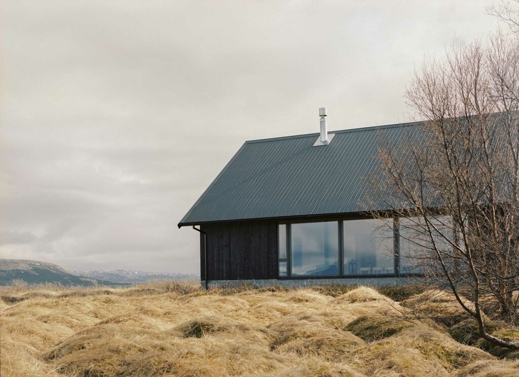 Black house in Iceland with large windows