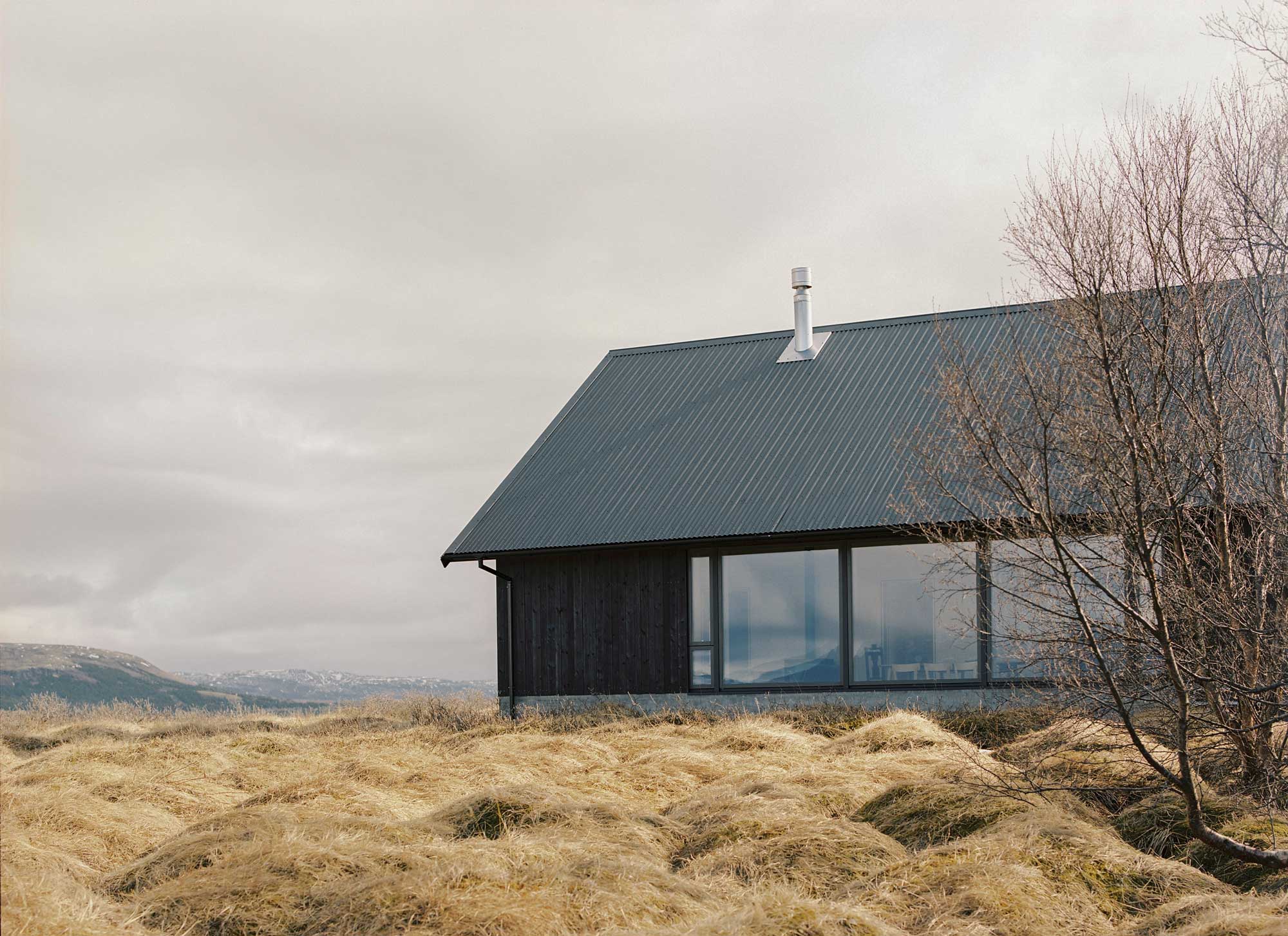 Black house in Iceland with large windows