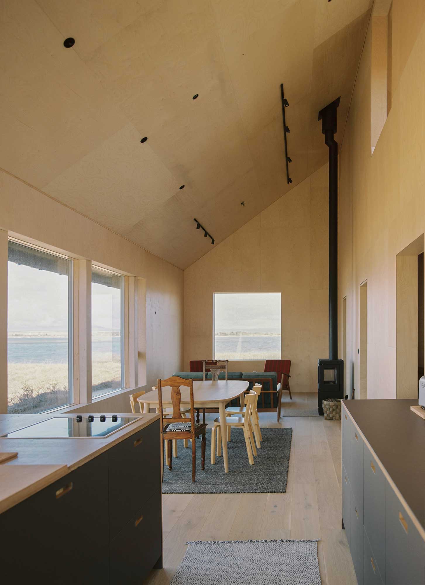 Summer home in Iceland with wooden interiors and fire stove