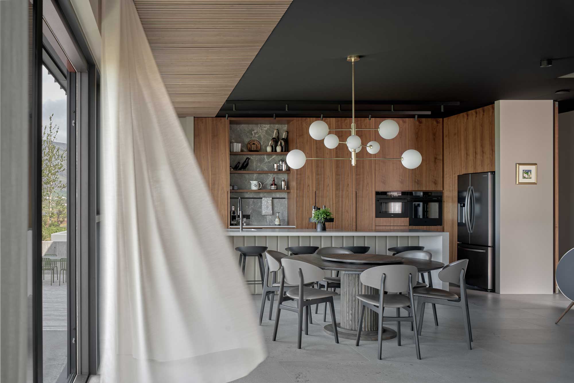Living room with open window and flying curtain